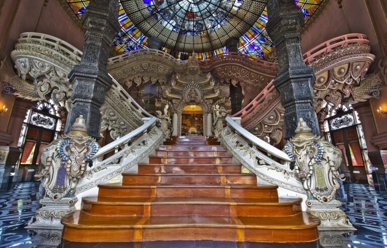 The staircase and stained glass inside the Erawan Museum