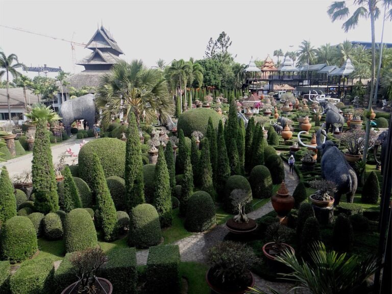 Clipped topiary and pavilions across the Nong Nooch gardens